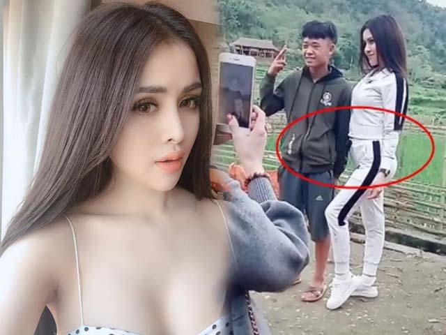 Thư Dung lộ bụng mỡ khi ưỡn ẹo tạo dáng, gương mặt chàng trai kế bên mới gây chú ý