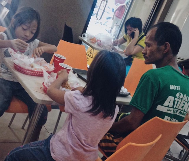 The changing life of a father in a picture staring at his children eating fried chicken - 1