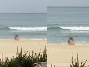 Xôn xao clip đôi nam nữ thản nhiên quấn lấy nhau giữa bãi biển giống tại Đà Nẵng, mặc kệ bão gần bờ